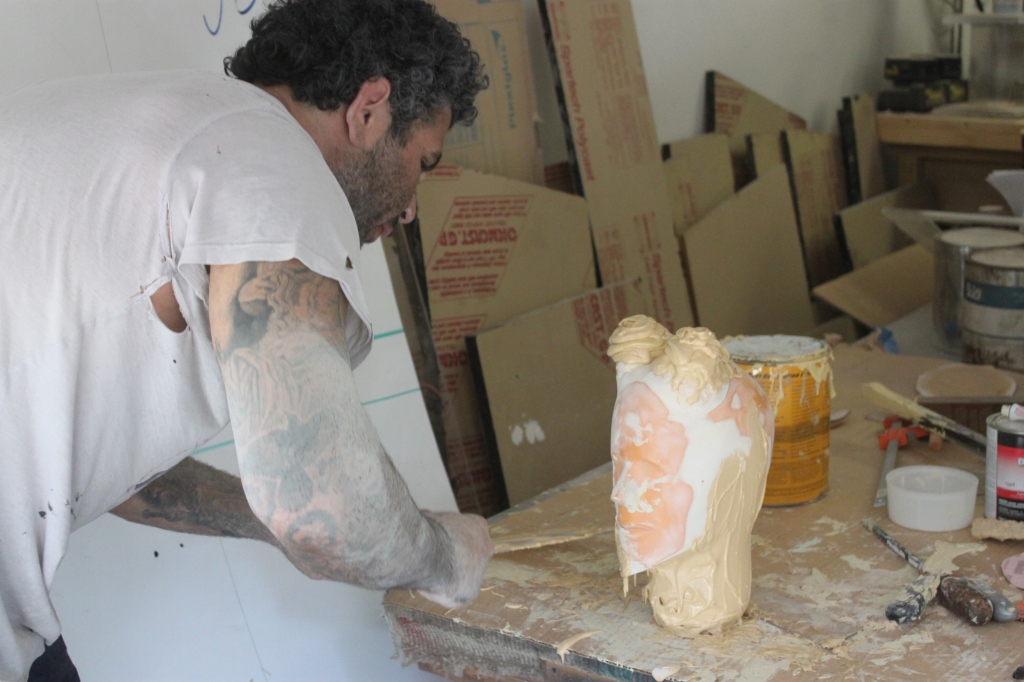 Aaron R. Thomas creating a new sculpture